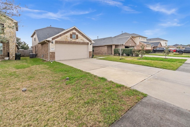 view of front of property with central AC unit, a front lawn, and a garage