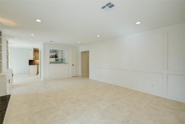 spare room with crown molding