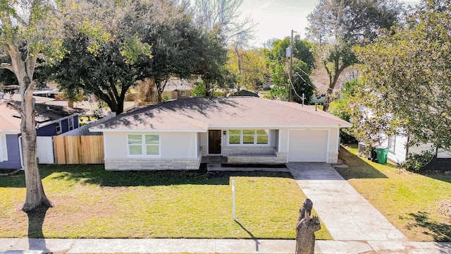 ranch-style house with a front yard and a garage