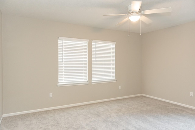 unfurnished room with light carpet and ceiling fan