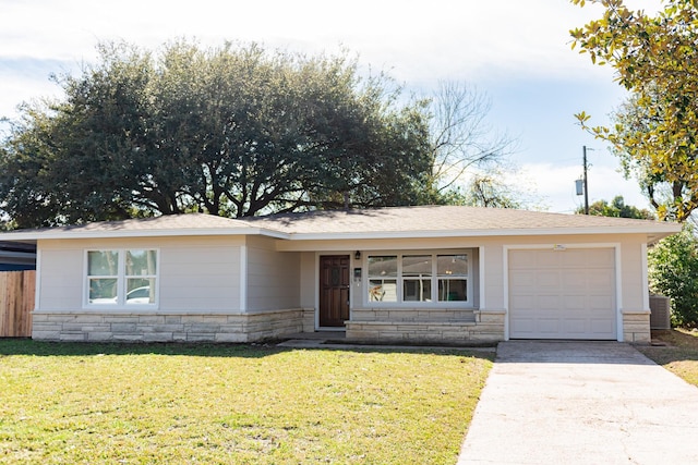 ranch-style home featuring a front yard and a garage