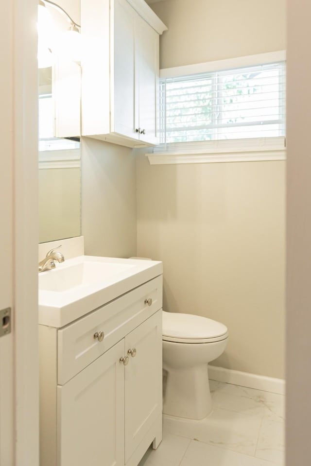 bathroom featuring toilet and vanity