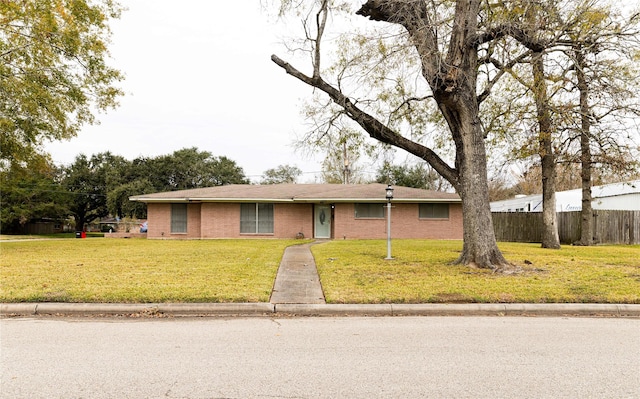 ranch-style house with a front lawn