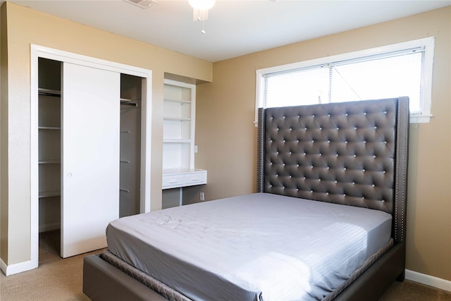 carpeted bedroom with ceiling fan