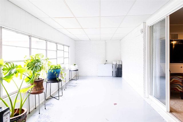 sunroom / solarium with a wealth of natural light and a paneled ceiling