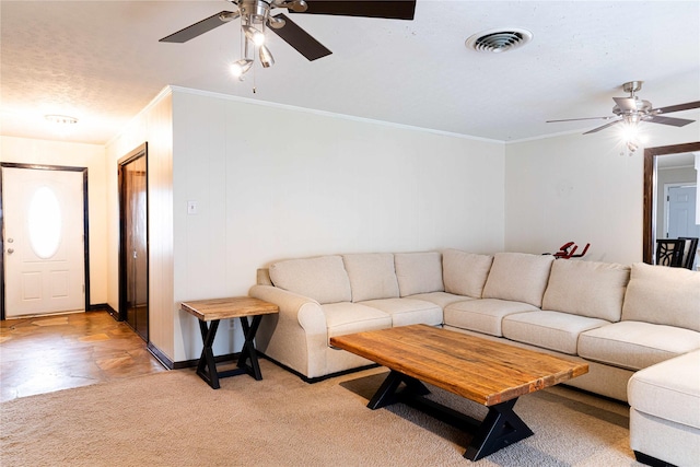 living room with crown molding and light colored carpet