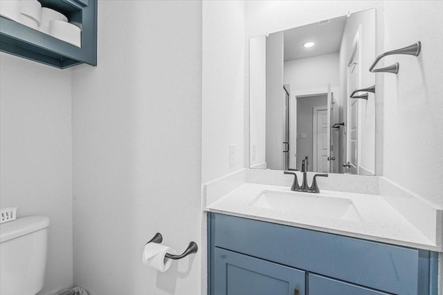 bathroom with vanity and toilet