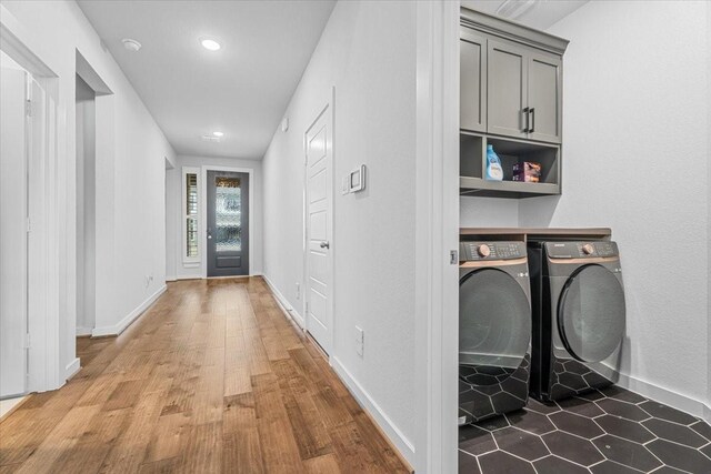 corridor featuring hardwood / wood-style floors and washer and clothes dryer