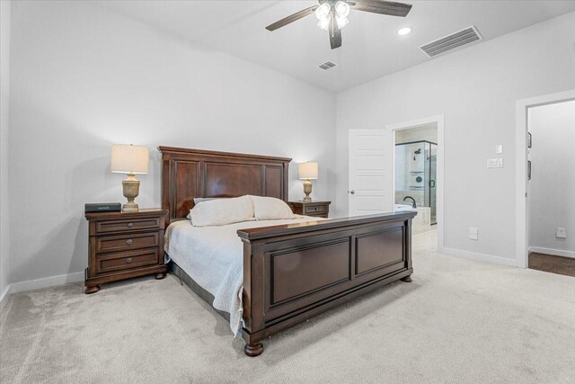 carpeted bedroom featuring connected bathroom and ceiling fan