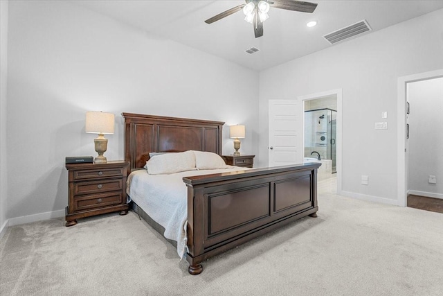 bedroom with visible vents, baseboards, and light colored carpet