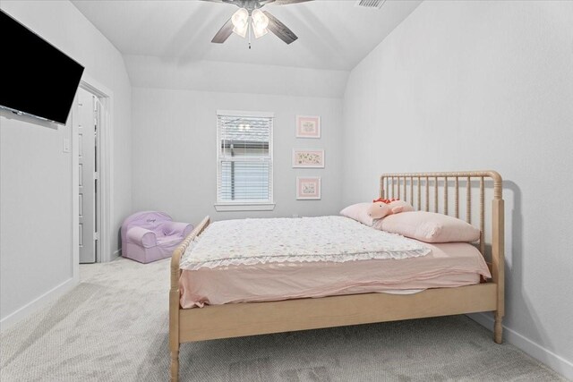 carpeted bedroom with lofted ceiling and ceiling fan