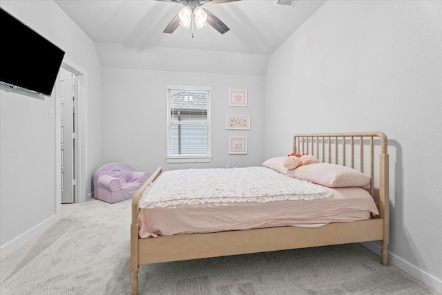 carpeted bedroom featuring visible vents, baseboards, ceiling fan, and vaulted ceiling