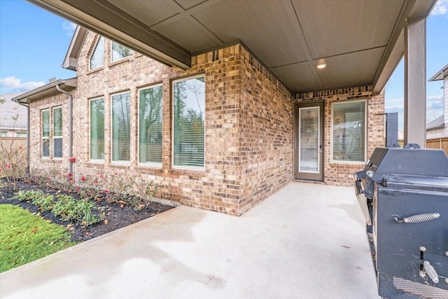 view of patio featuring a grill