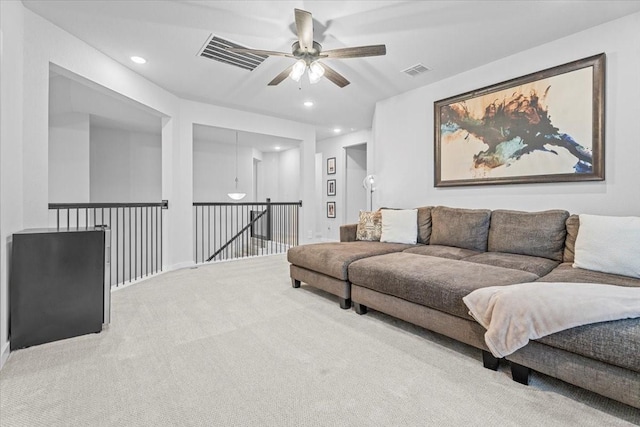 living area featuring recessed lighting, visible vents, carpet flooring, and a ceiling fan