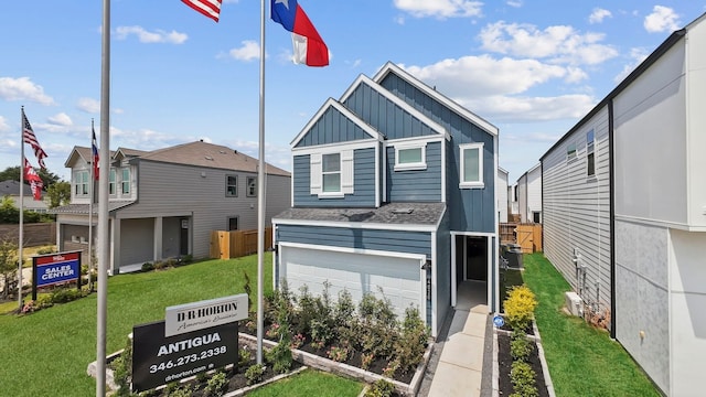 view of front facade featuring a garage and a front lawn