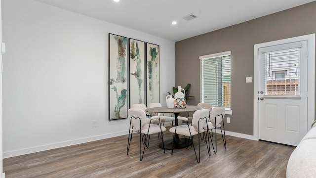 dining room with dark hardwood / wood-style flooring