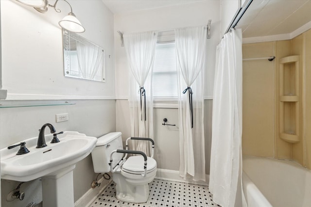 bathroom with toilet and shower / bath combination with curtain