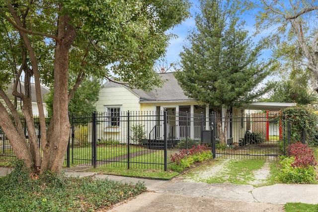 view of front facade featuring a front yard and a carport