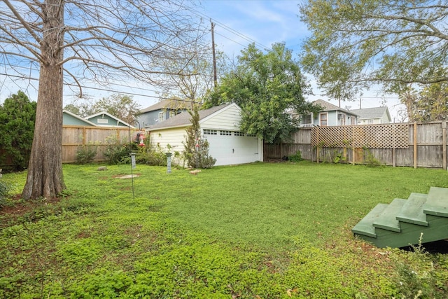 view of yard featuring an outdoor structure and a garage