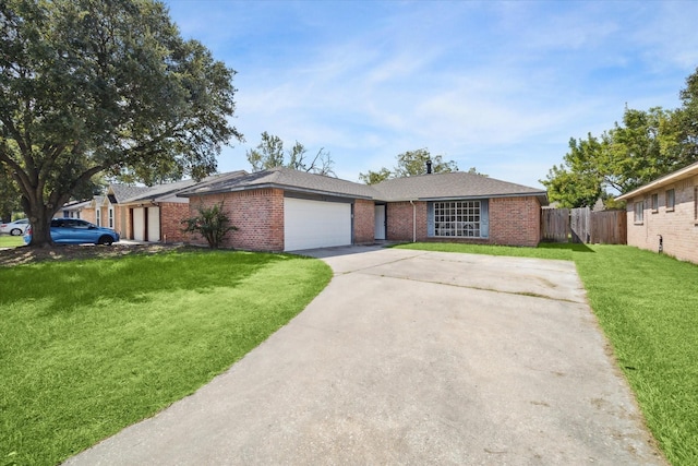 ranch-style home featuring a garage and a front yard