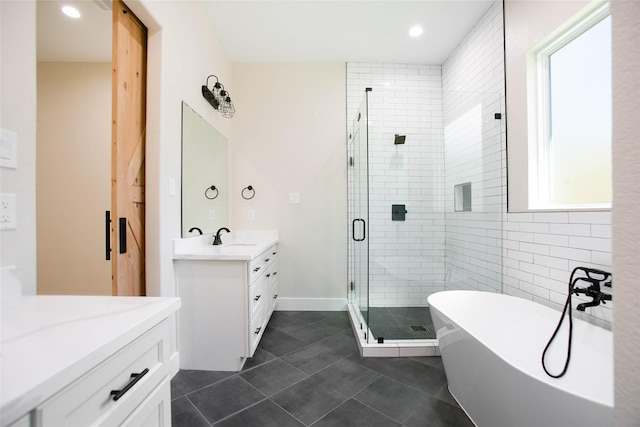 bathroom with vanity, tile patterned floors, and independent shower and bath