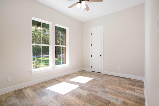 unfurnished room featuring ceiling fan and a healthy amount of sunlight