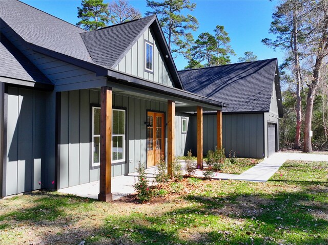 rear view of property with covered porch