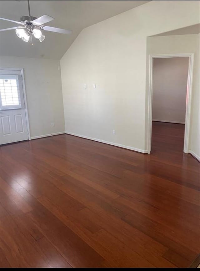 unfurnished room with lofted ceiling, ceiling fan, and dark hardwood / wood-style floors