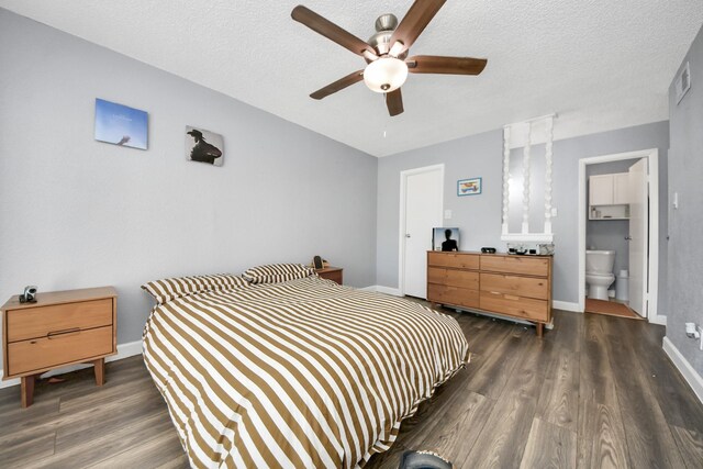 bedroom with ensuite bathroom, ceiling fan, dark hardwood / wood-style flooring, and a textured ceiling