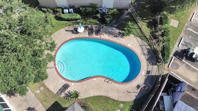 view of swimming pool featuring a patio area