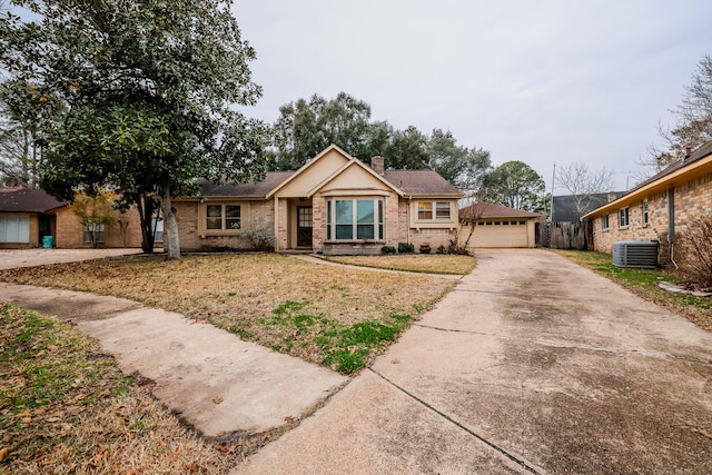 single story home with a garage and central AC