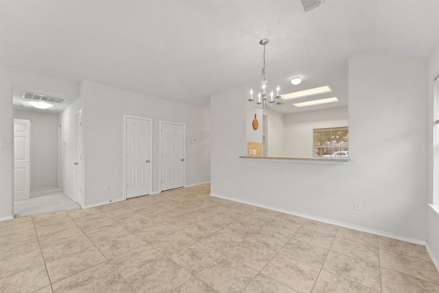 interior space featuring light tile patterned floors and a notable chandelier