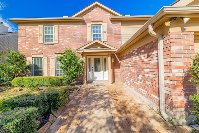 doorway to property with a patio area