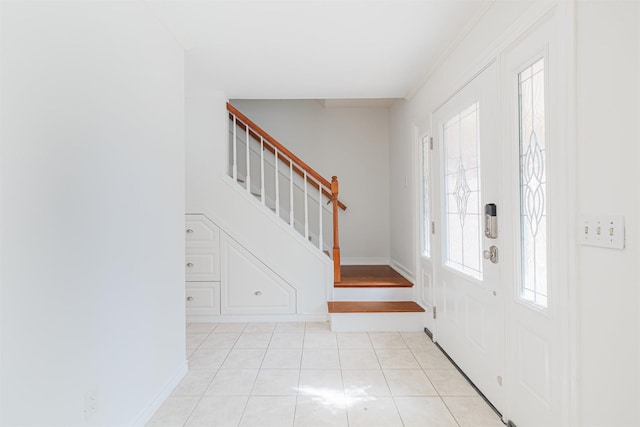 entrance foyer with light tile patterned floors