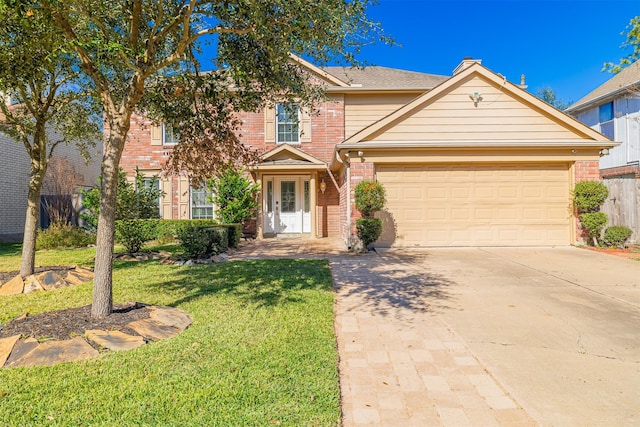 view of front of property with a garage and a front yard