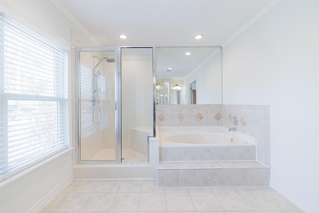 bathroom with a wealth of natural light, tile patterned floors, ornamental molding, and separate shower and tub