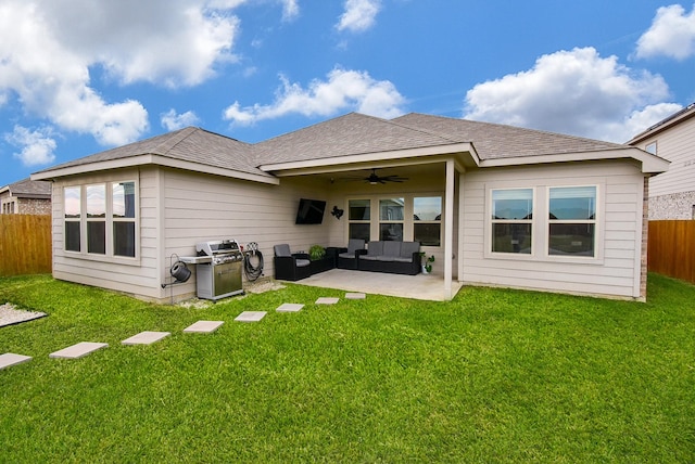 back of house featuring ceiling fan, a patio area, outdoor lounge area, and a yard