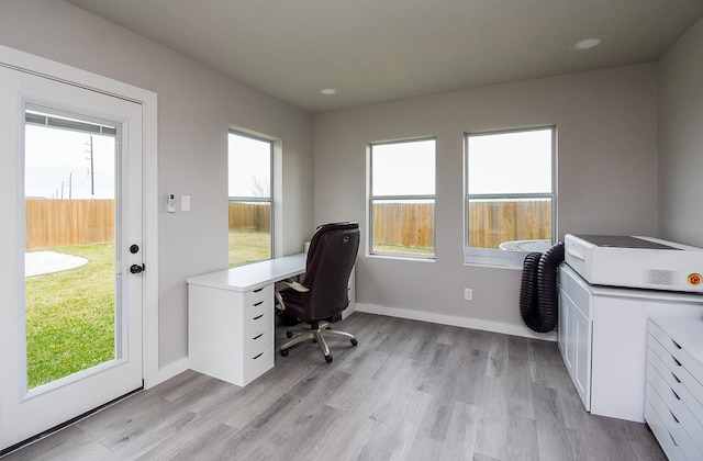 office with light hardwood / wood-style floors