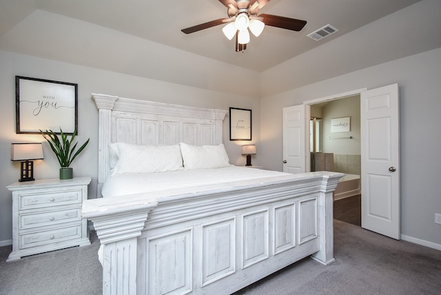 bedroom featuring ceiling fan, carpet flooring, and a tray ceiling