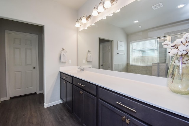 bathroom featuring hardwood / wood-style flooring and vanity