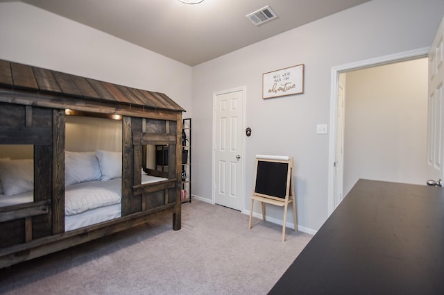 bedroom with light colored carpet