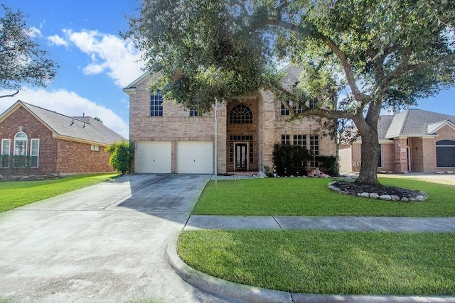 view of front of home featuring a garage and a front yard