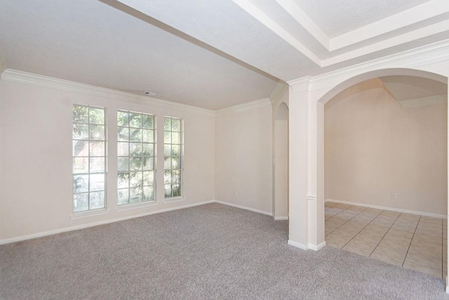 unfurnished room featuring light carpet, plenty of natural light, and ornamental molding