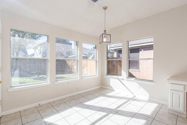 unfurnished dining area with light tile patterned floors