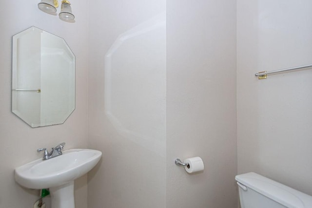 bathroom with sink and toilet