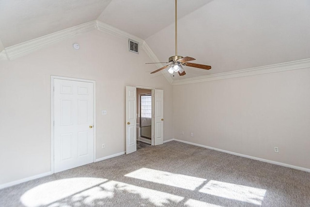 unfurnished bedroom with ceiling fan, vaulted ceiling, ornamental molding, and carpet flooring