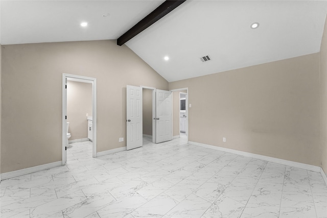 unfurnished bedroom featuring high vaulted ceiling, connected bathroom, and beam ceiling