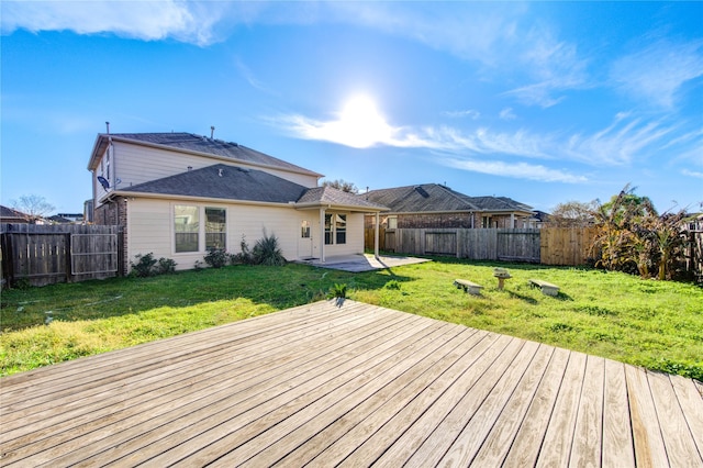 wooden terrace with a patio area and a yard