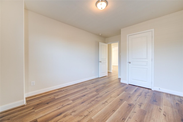 unfurnished room featuring light hardwood / wood-style floors