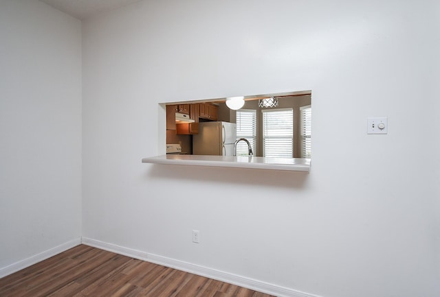 unfurnished room with dark hardwood / wood-style floors